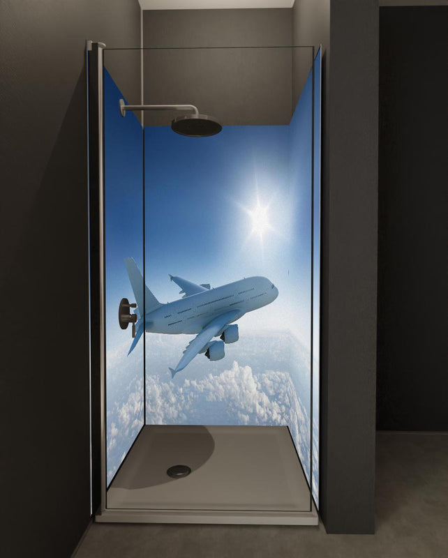 Duschrückwand - Flugzeug über weißen Wolken