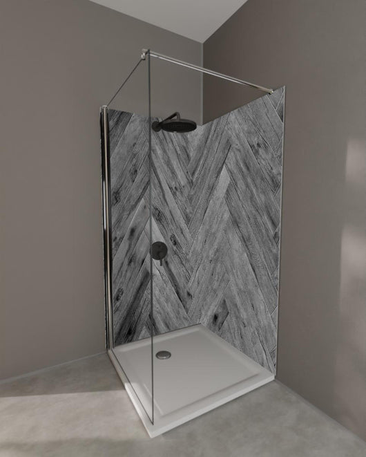 Duschrückwand - Gräuliches Holzparkett mit Fischgrätenmuster