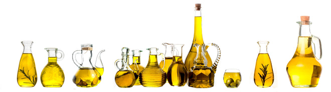 Küchenrückwand - Elegante Auswahl Gelber Olivenölflaschen