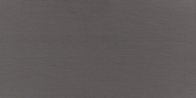 Küchenrückwand - Nahaufnahme einer grauen, strukturierten Oberfläche mit feinen Fasern