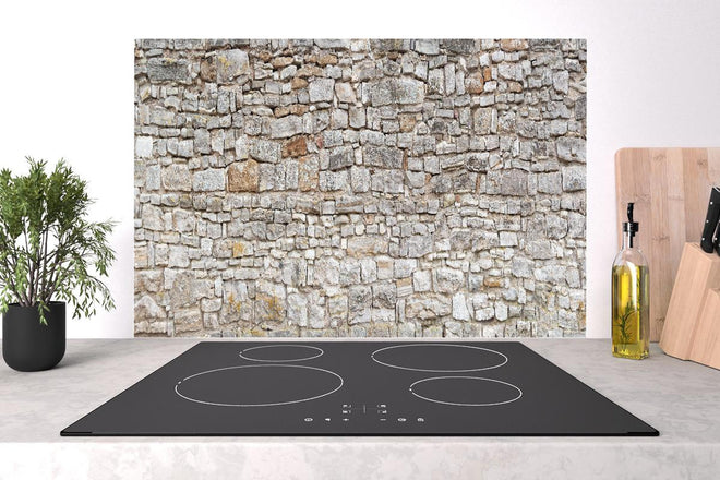 Spritzschutz - Gräuliche alte Mauer aus groben Steinen