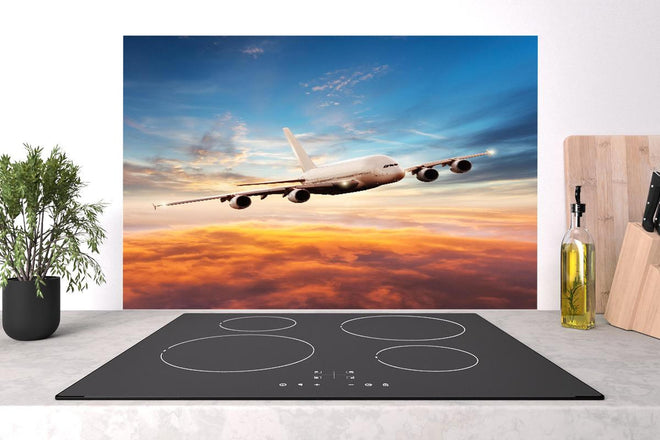 Spritzschutz - Jet im Sonnenuntergang über Wolken