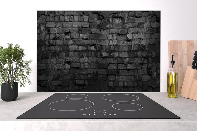 Spritzschutz - Schwarze alte Backsteinmauer