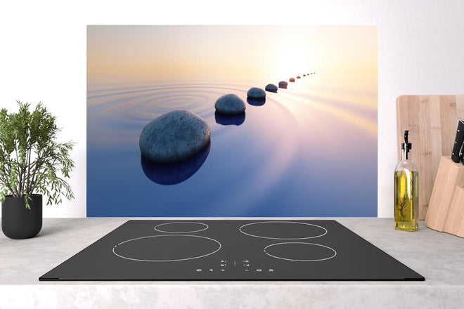 Spritzschutz - Steine im See bei Sonnenaufgang